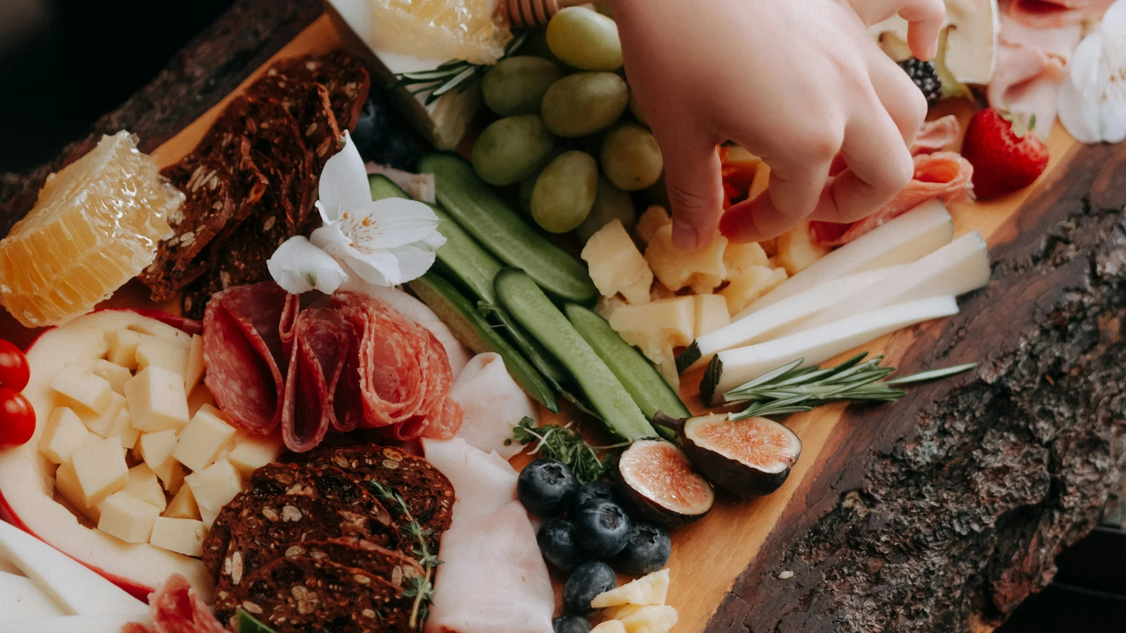 Artisan cheeses, charcuterie, fruit and accompaniments arranged for sharing
